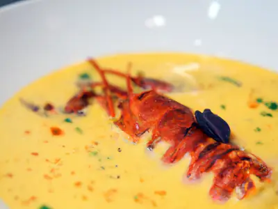 Exquisite Lobster Bisque with Saffron Infusion, plated and ready to serve